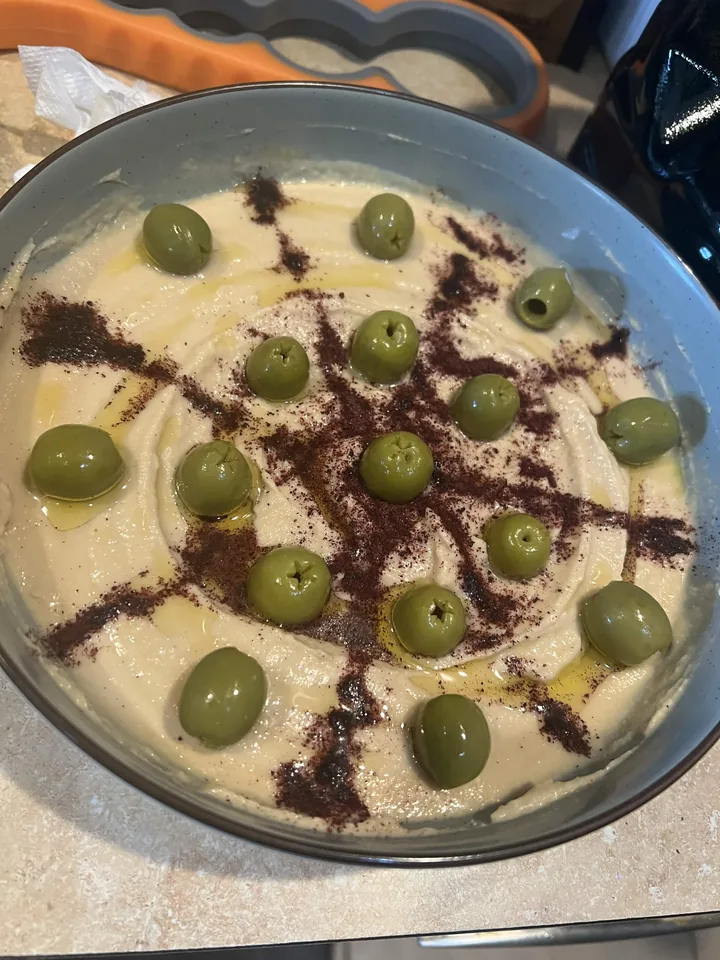 Homemade hummus with olives