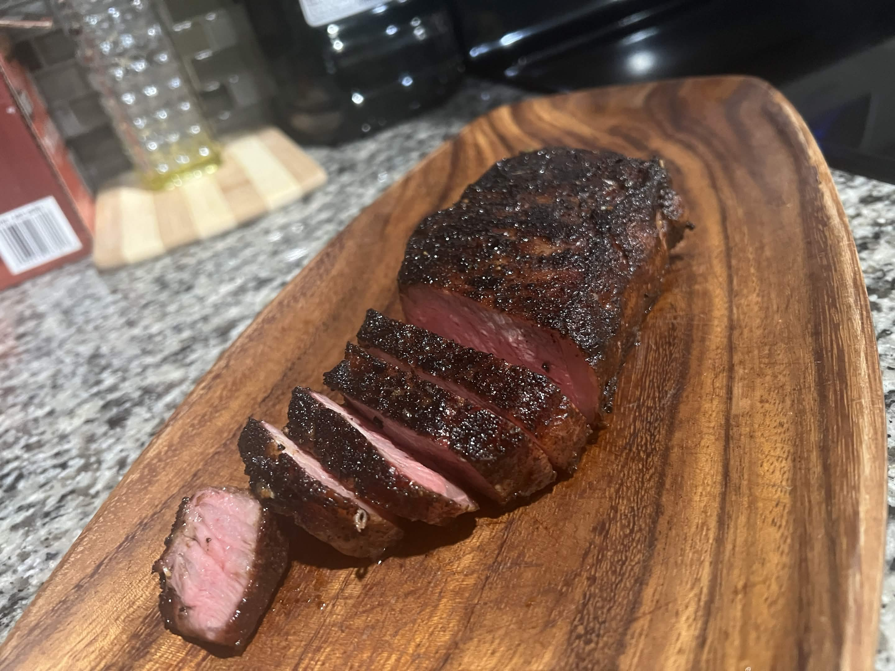 A home-cooked steak on a wooden board