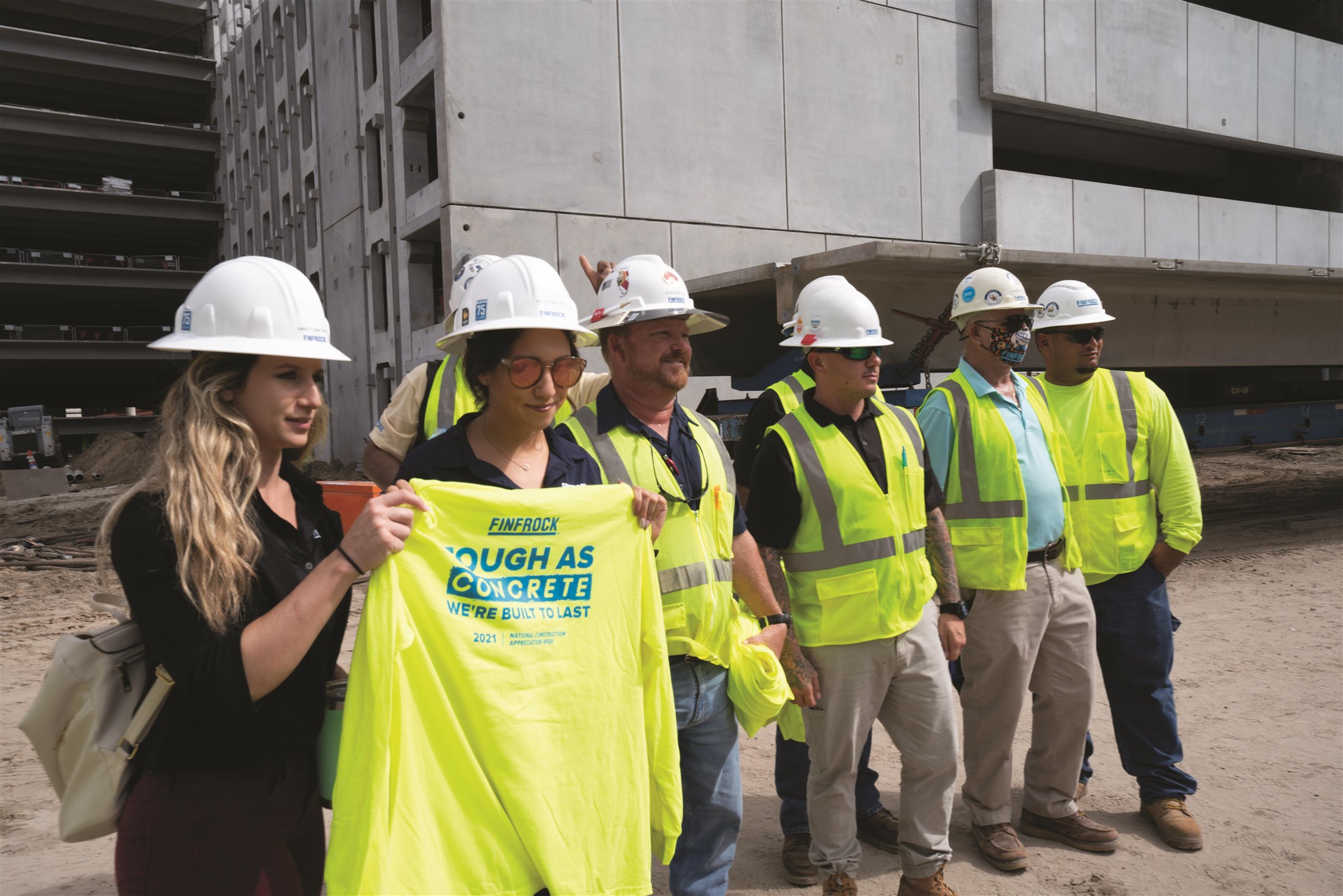 FINFROCK team holding Tough as Concrete apparel