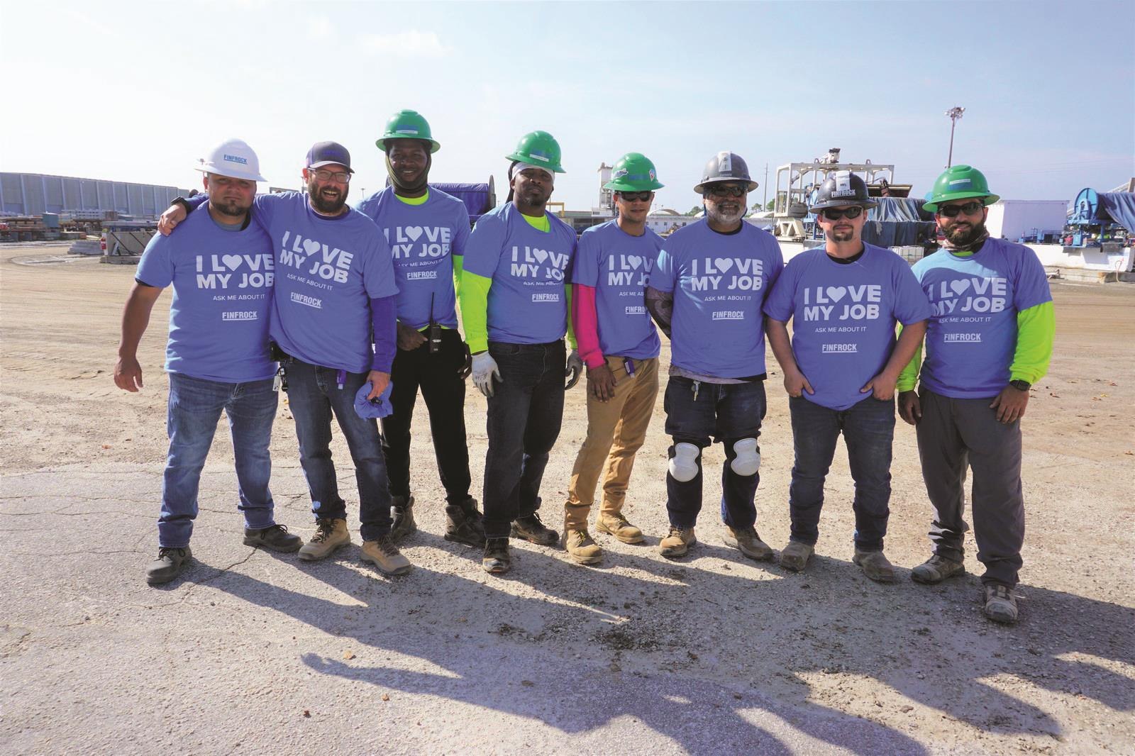 FINFROCK team wearing I Love My Job shirts